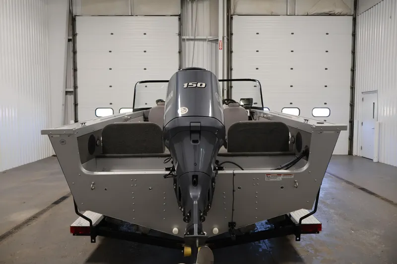 Slide: The Image of 2015 Starcraft Super Fisherman 186 boat with Yamaha 150 engine in a garage. - 6