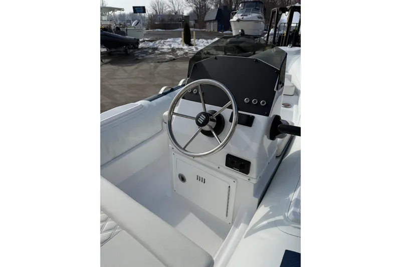 Slide: The Image of 2026 Novurania DL 430 boat steering console with modern controls and sleek design. - 4