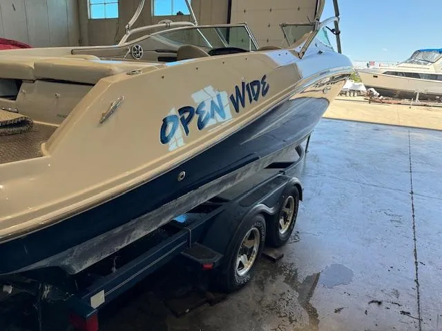 Slide: The Image of 2007 Sea Ray 230 Select boat on trailer in a garage. - 12