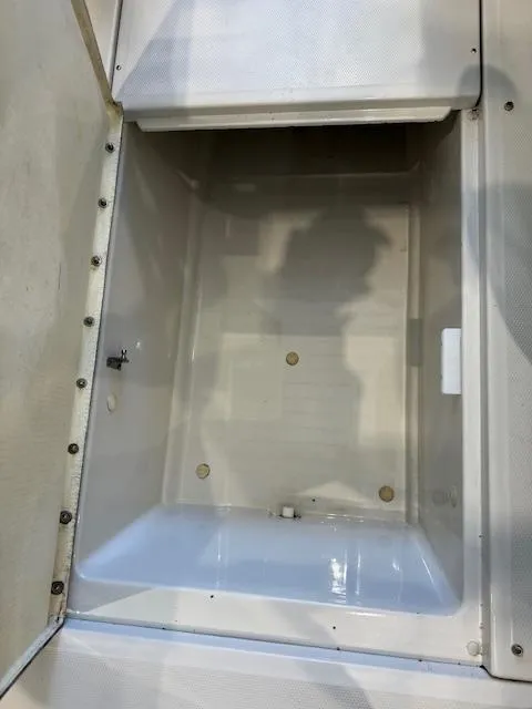 Slide: The Image of Storage compartment of a 2007 Sea Ray 230 Select boat. - 16