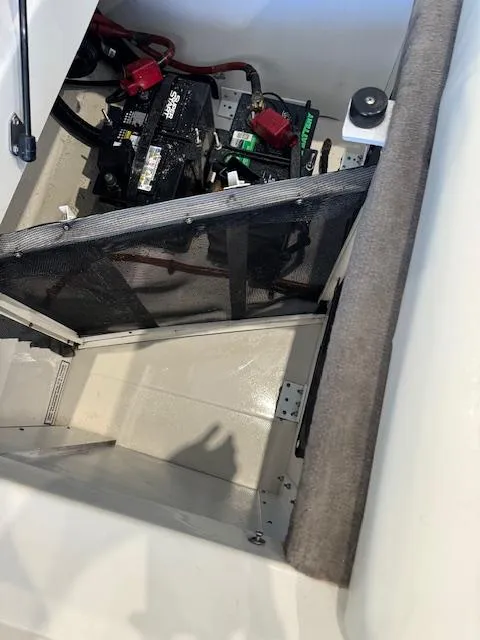 Slide: The Image of 2007 Sea Ray 230 Select boat battery compartment with wiring and components. - 3