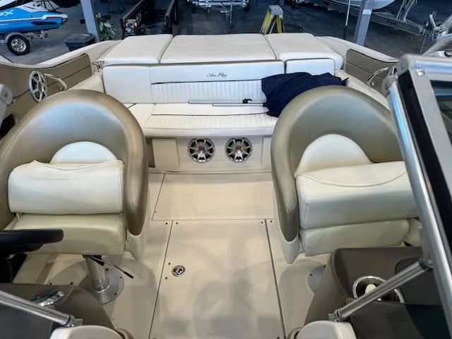 Slide: The Image of 2007 Sea Ray 230 Select boat interior with beige seating and speakers. - 6
