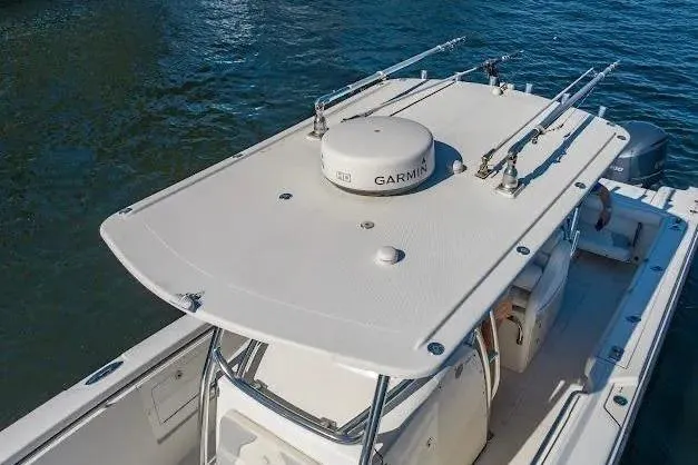 Slide: The Image of 2010 Edgewater 318CC boat with Garmin equipment on calm water. - 16