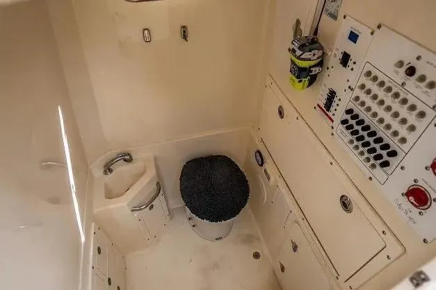 Slide: The Image of Interior of 2010 Edgewater 318CC boat, featuring control panel and compact sink. - 20