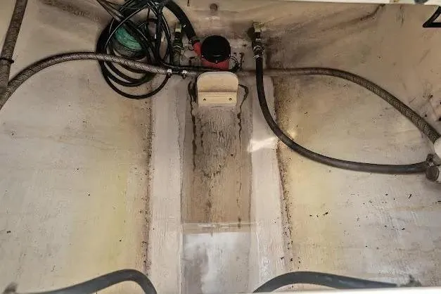 Slide: The Image of Bilge area of a 2010 Edgewater 318CC boat with hoses and pump. - 22