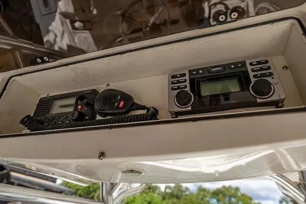 Slide: The Image of Boat dashboard with communication devices on a 2010 Edgewater 318CC. - 24