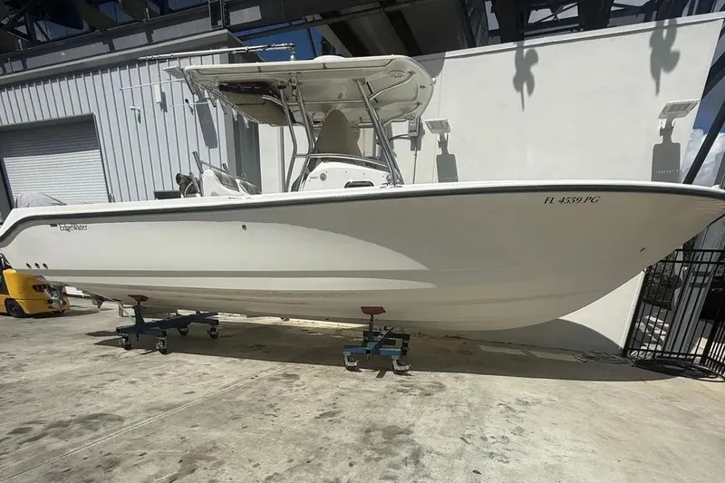 Slide: The Image of 2010 Edgewater 318CC boat on stands in a storage facility. - 3