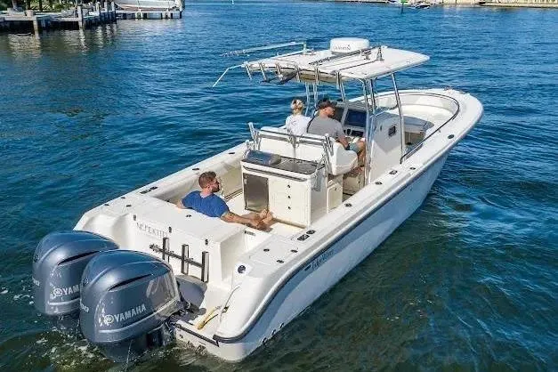 Slide: The Image of 2010 Edgewater 318CC boat with Yamaha engines cruising on a sunny day. - 6