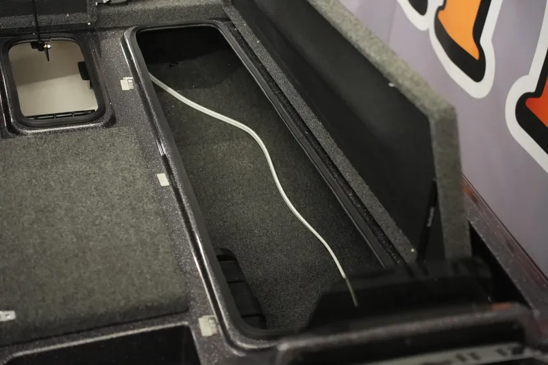 Slide: The Image of Open storage compartment in 2025 Bass Cat Puma STS boat, showcasing interior design. - 19