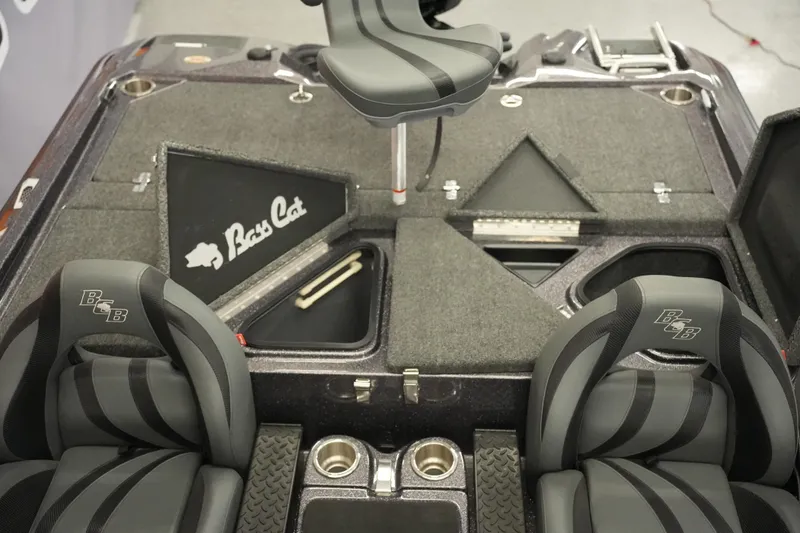 Slide: The Image of 2025 Bass Cat Puma STS boat storage compartments with open lids. - 22