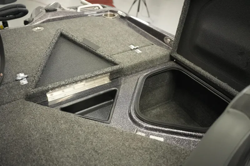 Slide: The Image of 2025 Bass Cat Puma STS boat dashboard with steering wheel and electronic controls. - 25