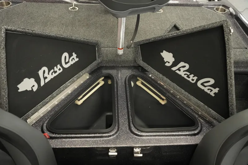 Slide: The Image of 2025 Bass Cat Puma STS boat interior storage compartment with open hatch. - 26