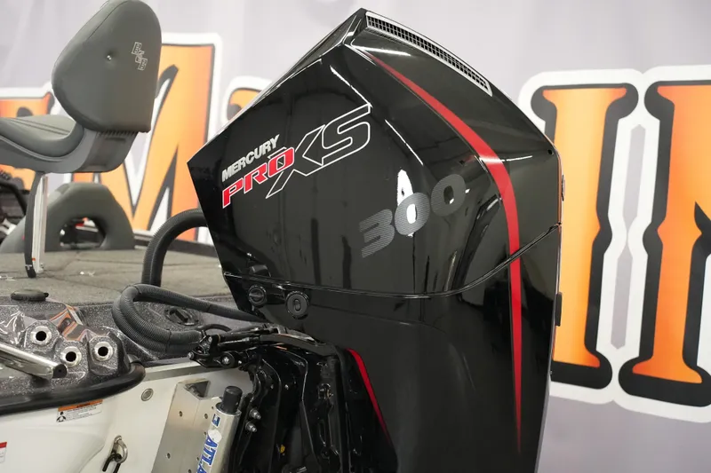 Slide: The Image of 2025 Bass Cat Puma STS boat interior with storage compartments and carpeted deck. - 6