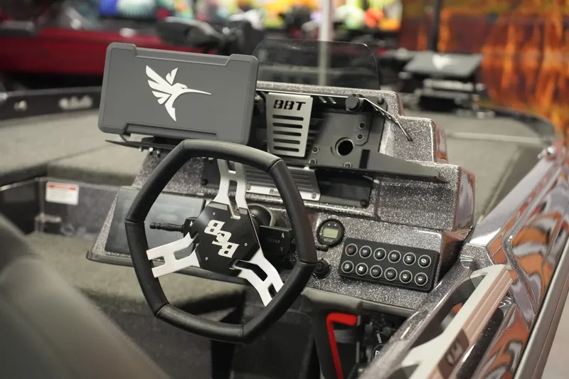 Slide: The Image of 2025 Bass Cat Puma STS boat with Minn Kota trolling motor on display. - 8