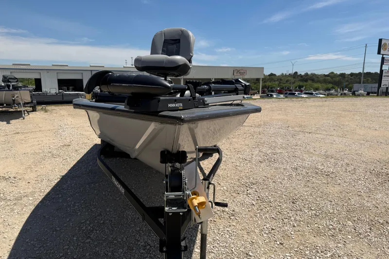 Slide: The Image of 2018 Tracker Pro Team 190 TX boat on gravel lot, featuring Minn Kota trolling motor. - 10