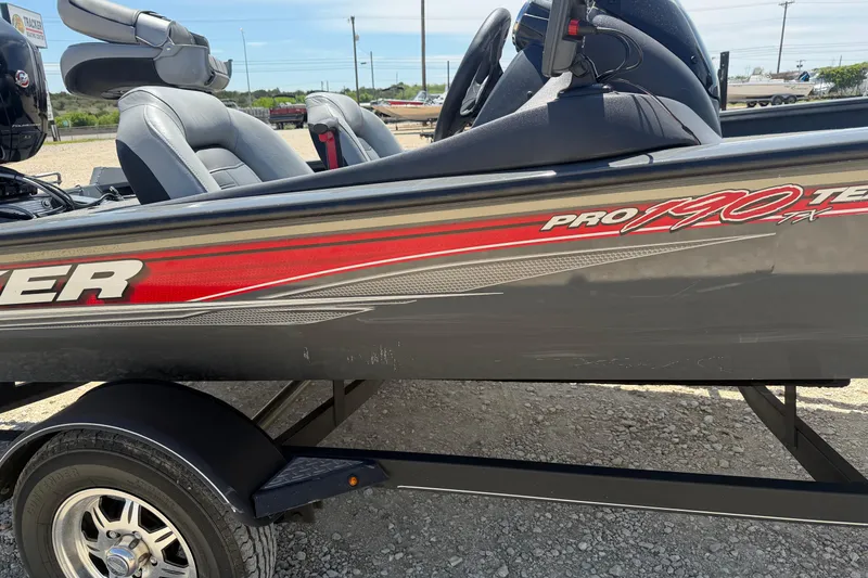 Slide: The Image of 2018 Tracker Pro Team 190 TX boat with gray and red detailing on trailer. - 4
