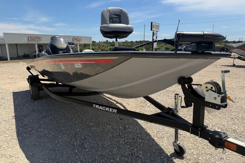 Slide: The Image of 2018 Tracker Pro Team 190 TX boat on trailer in outdoor dealership lot. - 5