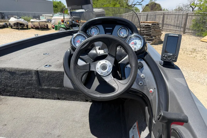 Slide: The Image of Steering console of 2018 Tracker Pro Team 190 TX boat with gauges and navigation system. - 9