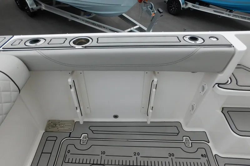 Slide: The Image of 2023 Pursuit OS 325 Offshore boat deck with rod holders and measuring guide. - 12