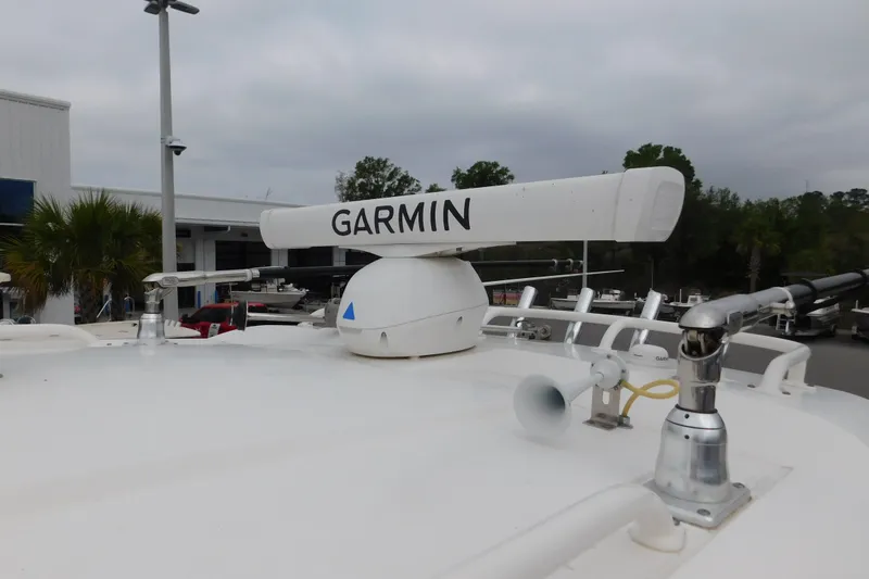 Slide: The Image of 2023 Pursuit OS 325 Offshore boat with Garmin radar system on deck. - 20