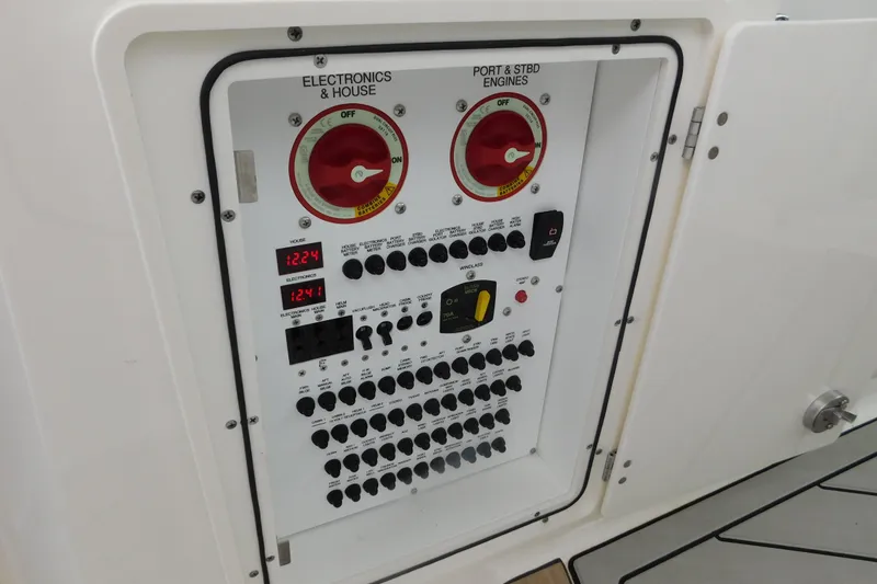 Slide: The Image of Electrical control panel on a 2023 Pursuit OS 325 Offshore boat. - 26