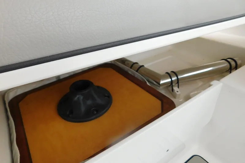 Slide: The Image of 2023 Pursuit OS 325 Offshore boat interior storage compartment detail. - 28