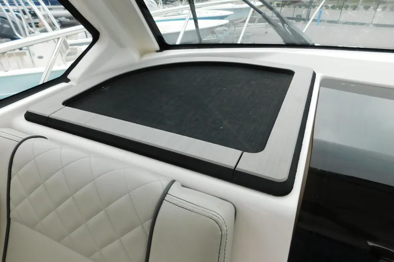 Slide: The Image of 2023 Pursuit OS 325 Offshore interior with sleek dashboard and comfortable seating. - 31