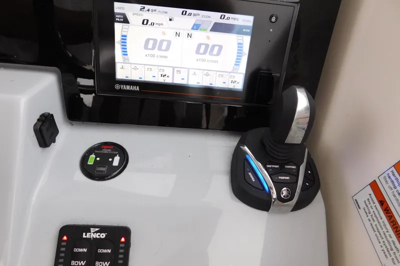 Slide: The Image of Control panel of 2023 Pursuit OS 325 Offshore boat with Yamaha display and joystick. - 38
