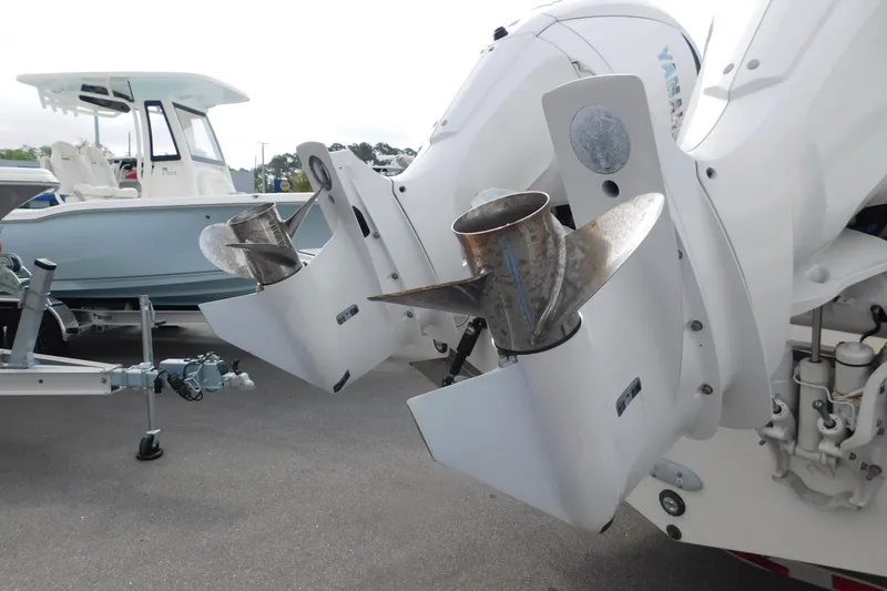 Slide: The Image of 2023 Pursuit OS 325 Offshore boat with dual outboard engines and propellers. - 4