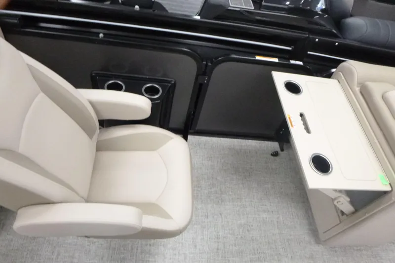 Slide: The Image of 2026 Premier 230 Sunsation RF - CL interior with beige seating and foldable table. - 11