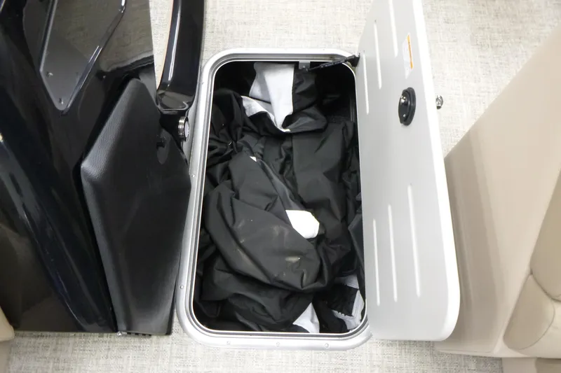 Slide: The Image of Storage compartment in 2026 Premier 230 Sunsation RF - CL boat, containing black fabric. - 7