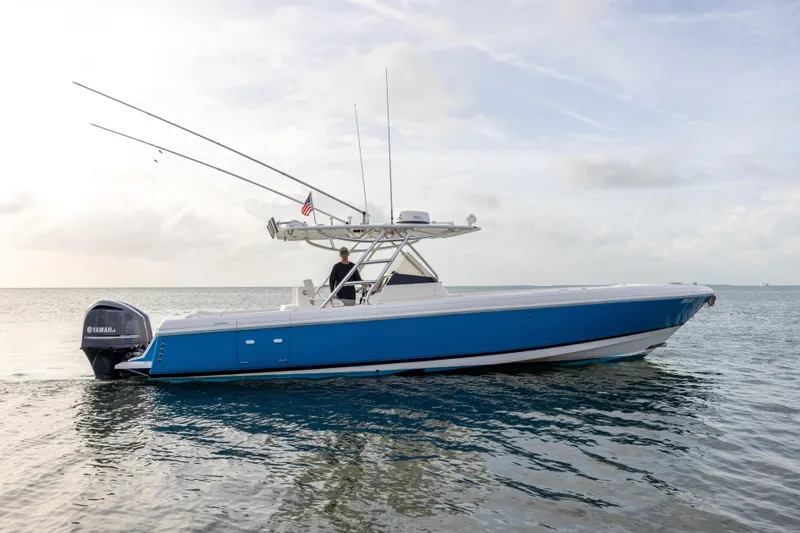 The Image of 2011 Intrepid 370 Center Console boat on calm ocean waters. - 1