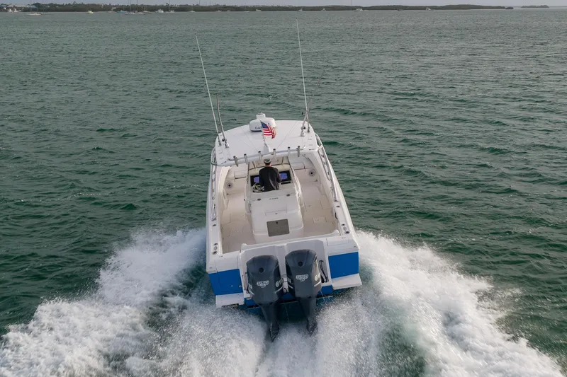 Slide: The Image of 2011 Intrepid 370 Center Console boat cruising on open water. - 11