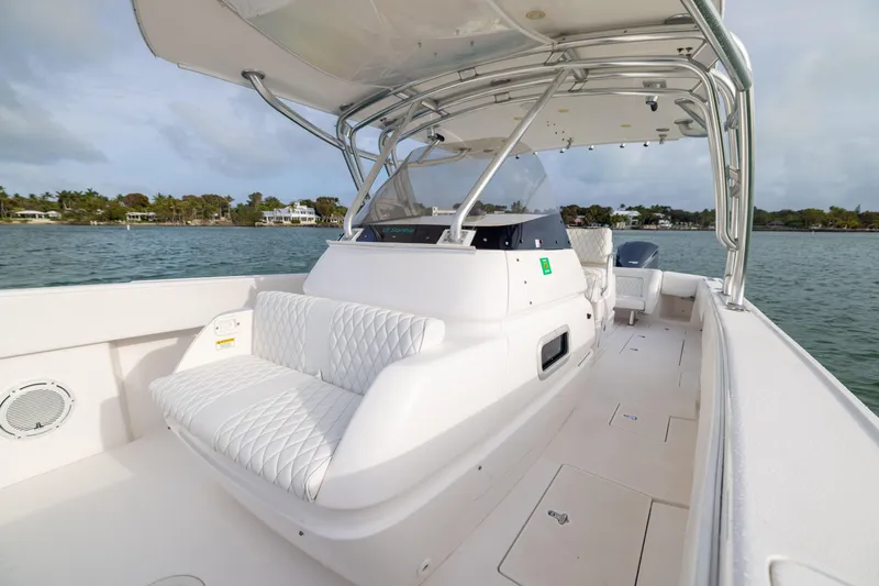 Slide: The Image of 2011 Intrepid 370 Center Console boat on water, featuring sleek design and comfortable seating. - 18