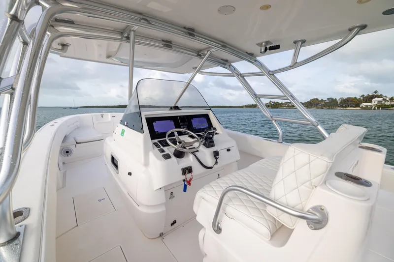 Slide: The Image of 2011 Intrepid 370 Center Console boat interior with steering wheel and navigation screens. - 22