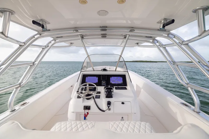 Slide: The Image of 2011 Intrepid 370 Center Console boat interior with navigation screens and steering wheel. - 24