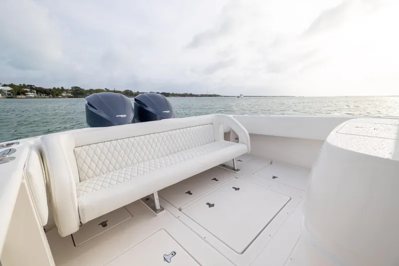 Slide: The Image of 2011 Intrepid 370 Center Console boat with twin engines and white seating on open water. - 26