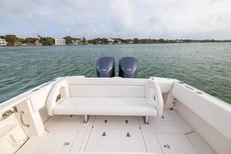 Slide: The Image of 2011 Intrepid 370 Center Console boat with twin engines on calm water. - 28