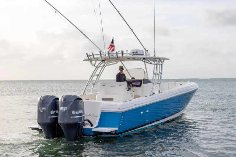 Slide: The Image of 2011 Intrepid 370 Center Console boat with dual Yamaha engines on open water. - 3