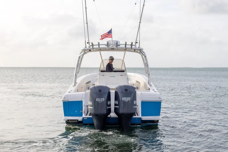 Slide: The Image of 2011 Intrepid 370 Center Console boat with dual Yamaha engines on open water. - 5