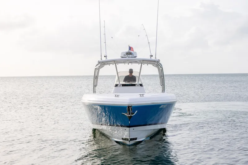 Slide: The Image of 2011 Intrepid 370 Center Console boat cruising on calm ocean waters. - 6