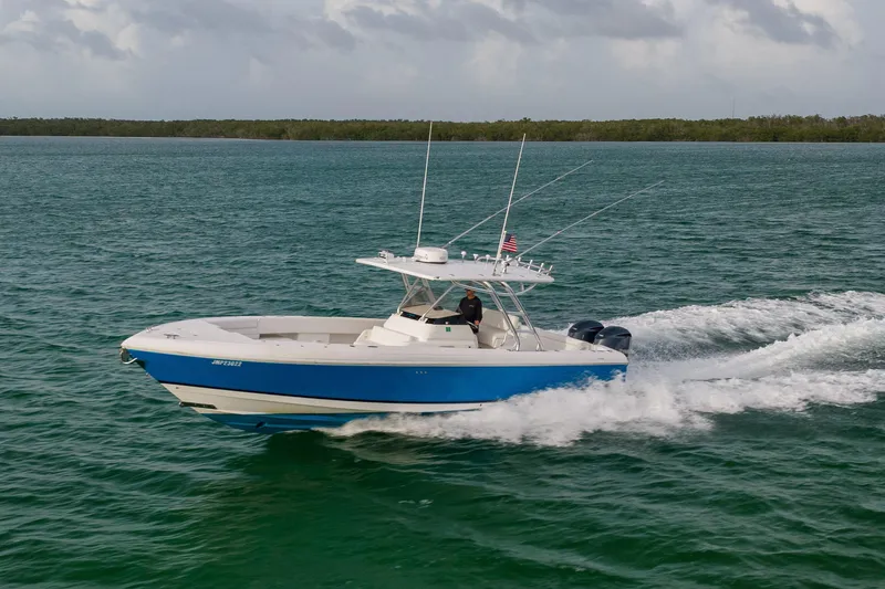 Slide: The Image of 2011 Intrepid 370 Center Console boat cruising on open water. - 8