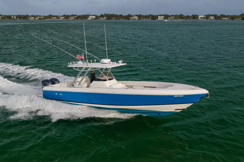 Slide: The Image of 2011 Intrepid 370 Center Console boat cruising on open water. - 9