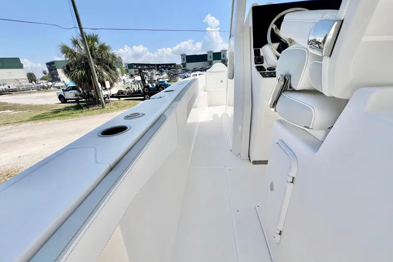 Slide: The Image of 2026 Stamas 33T Aventura boat interior with sleek white seating and modern controls. - 11