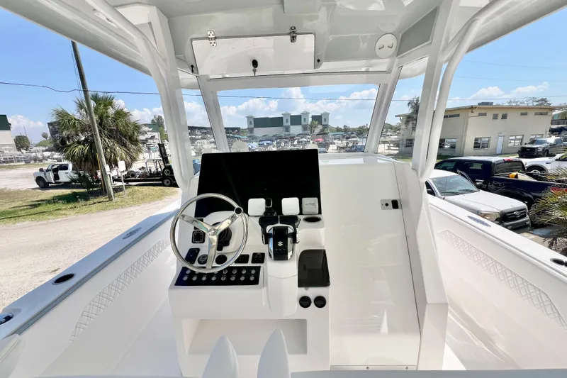 Slide: The Image of 2026 Stamas 33T Aventura boat cockpit with modern steering and control panel. - 12