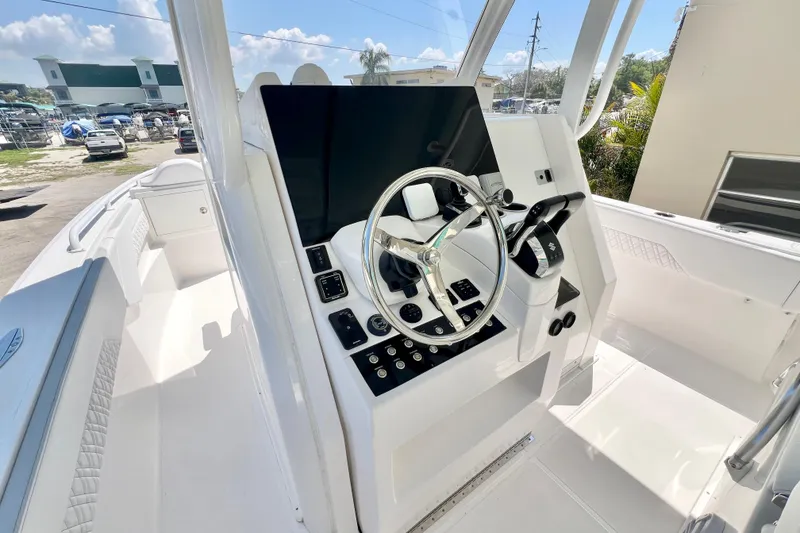 Slide: The Image of 2026 Stamas 33T Aventura boat cockpit with modern steering and control panel. - 13