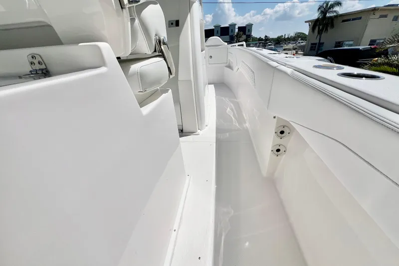 Slide: The Image of 2026 Stamas 33T Aventura boat interior, showcasing sleek white seating and modern design elements. - 14
