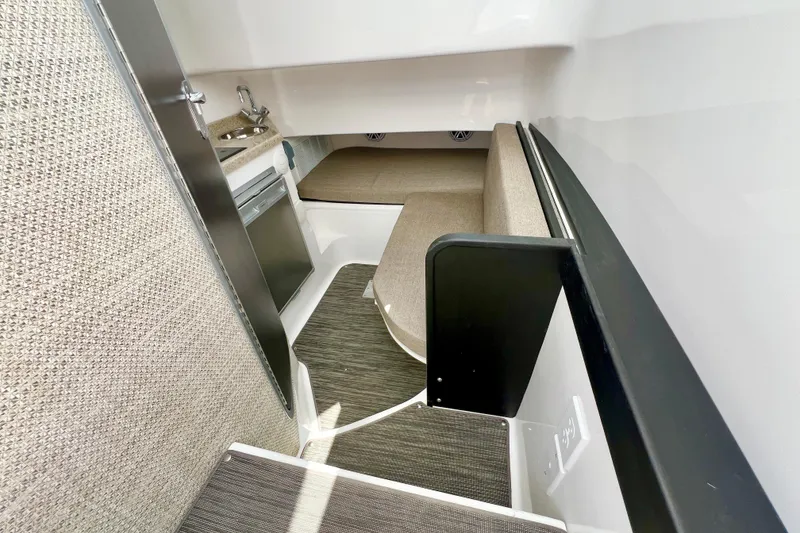 Slide: The Image of Interior cabin of 2026 Stamas 33T Aventura boat with seating and kitchenette. - 17