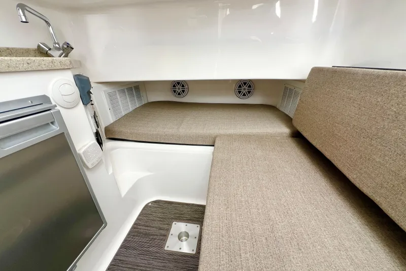 Slide: The Image of Interior cabin of 2026 Stamas 33T Aventura boat with seating and kitchenette. - 18