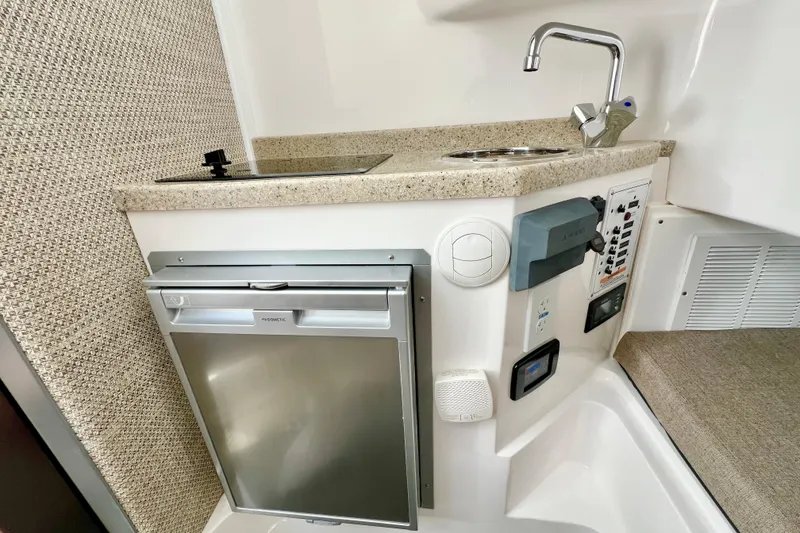 Slide: The Image of Compact kitchenette in 2026 Stamas 33T Aventura boat with sink, stove, and fridge. - 19